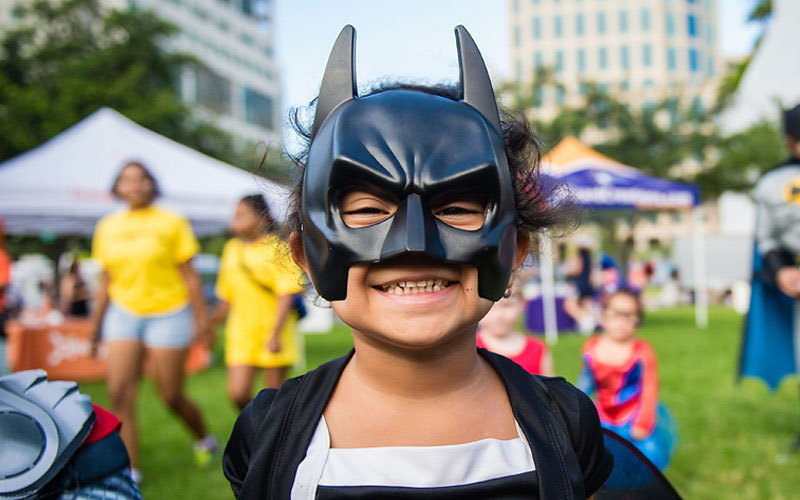 Child wearing batman mask